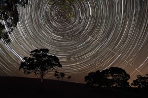 The International Space Station appears to pierce a path across the radiant, concentric star trails seemingly spinning over the silhouettes of the trees in Harrogate, South Australia. Highly Commended in the "Young Astronomy Photographer" category. Image: Scott Carnie-Bronca