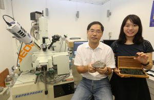 Miss Jessie Kwan Long-ching (left), under the supervision of Professor Zhao Guochun, conducts her research with the aid of the Electron Probe Micro-Analyzer (EPMA). Credit: The University of Hong Kong