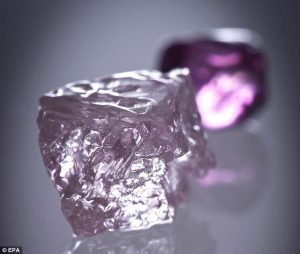 The Argyle Pink Jubilee diamond with a smaller Argyle pink diamond in the background