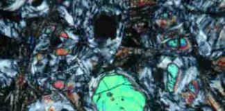 fresh olivine (large green, blue and pink crystals) and glass inclusion (lower left inset)