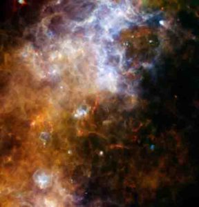 Some of the coldest and darkest dust in space shines brightly in this infrared image from the Herschel Observatory.