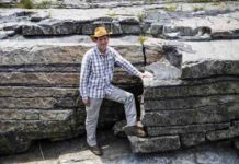 This is professor Rais Latypov in front of an example of the stratified chromite layers.