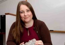 Jessica Irving sits with two meteorites Princeton seismologist Jessica Irving