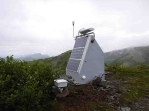Transportable Array station P19K is one of the closest stations to the Iniskin earthquake origin. Solar panels power the station, and the seismometer is buried in a specially drilled borehole to insulate it from surface noise. Photo taken in 2017 during a service site visit by Incorporated Research Institutions for Seismology (IRIS). IRIS manages the Transportable Array station installation and maintenance. Credit: Doug Bloomquist, IRIS