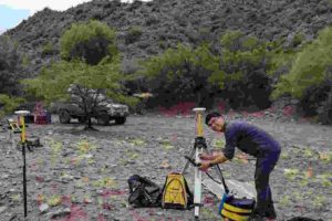 U of T's Jeremy Rimando sets up Differential Global Positioning System (DGPS) survey equipment to measure the amount of displacement on the Las Chacras Fault in San Juan, Argentina. 