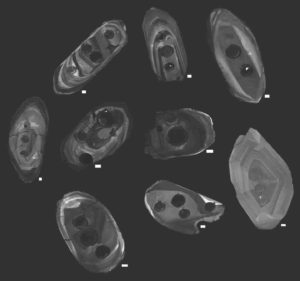 Zircons studied by the research team, photographed using cathodoluminescence, a technique that allowed the team to visualize the interiors of the crystals using a specialized scanning electron microscope. Dark circles on the zircons are the cavities left by the laser that was used to analyze the age and chemistry of the zircons.Scientists led by Michael Ackerson, a research geologist at the Smithsonian's National Museum of Natural History, provide new evidence that modern plate tectonics, a defining feature of Earth and its unique ability to support life, emerged roughly 3.6 billion years ago. The study, published May 14 in the journal Geochemical Perspective Letters, uses zircons, the oldest minerals ever found on Earth, to peer back into the planet's ancient past.The team tested more than 3,500 zircons, each just a couple of human hairs wide, by blasting them with a laser and then measuring their chemical composition with a mass spectrometer. These tests revealed the age and underlying chemistry of each zircon. Of the thousands tested, about 200 were fit for study due to the ravages of the billions of years these minerals endured since their creation. Credit: Michael Ackerson, Smithsonian.