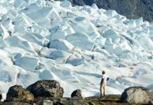 332 colossal canyons just revealed beneath Antarctica’s ice Anders Carlson, a UW–Madison geologist, surveys an outlet glacier in southwest Greenland. Carlson and colleagues from UW–Madison and Oregon State University have shown that melting ice from Greenland may have raised ocean levels less than expected during the most-recent prolonged warm spell on Earth. The surprising patterns of ice melt found by new research suggest that Greenland’s ice sheet may be more stable — and Antarctica’s less stable — than previously thought. Credit: Photo courtesy Robert Hatfield, Oregon State University