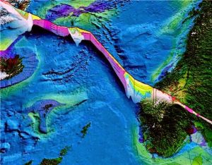 The islands along the Mid-Atlantic Ridge, such as Iceland and Jan Mayen, were created from red-hot lava escaping from the Earth's crust. The illustration shows a cross-section of the different layers of rock in the Earth's crust, both on land and the seabed. Areas along this fissure can be the source of valuable minerals.  Credit: Geological Survey of Norway