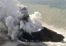 Volcano raises new island far south of Japan