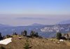 Mountains and winds confound particle distribution