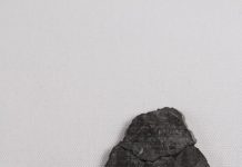 Dating the moon-forming impact event with meteorites