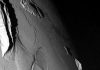 Squeezing out mountains, mathematically, on Jupiter’s moon Io