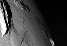 Squeezing out mountains, mathematically, on Jupiter’s moon Io