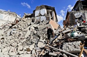 A man walks amid rubbles after an earthquake struck in Amatrice Italy, Wednesday, Aug. 24, 2016. The magnitude 6 quake struck at 3:36 a.m. (0136 GMT) and was felt across a broad swath of central Italy, including Rome where residents of the capital felt a long swaying followed by aftershocks.(AP Photo/Alessandra Tarantino)