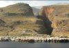Earthquake series cause uplift variations at continental margins