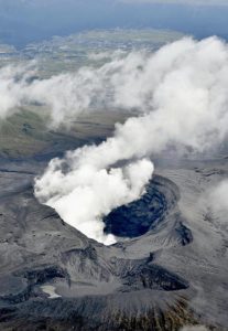 In this aerial view, plumes of white smoke rise from Mount Aso Nakadake Crater in Kumamoto Prefecture, southern Japan, Saturday morning, Oct. 8, 2016 following eruptions earlier in the day. Mount Aso has sent huge plumes of gray smoke as high as 11 kilometers (6.8 miles) into the air in one of the volcano's biggest explosions in years. Credit: Hiroko Harima/Kyodo News via AP)