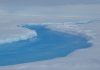 Mysterious ‘crater’ on Antarctica indication of vulnerable ice sheet Meltwater stream inside the crater on the Roi Baudouin ice shelf. Credit: Stef Lhermitte