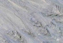 Water On Mars? : Previous evidence of water on Mars now identified as grainflows This HiRISE image cutout shows Recurring Slope Lineae in Tivat crater on Mars in enhanced color