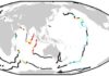 A one-two punch may have helped deck the dinosaurs Colored and black points mark the global distribution of mid-ocean ridges, with ages of 66 million years ago created at spreading rates above and below 35 millimeters a year, respectively.