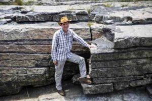 This is professor Rais Latypov in front of an example of the stratified chromite layers.