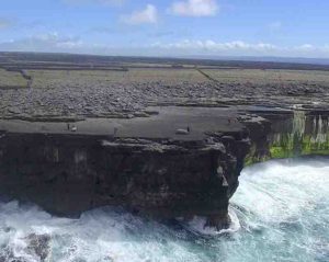 An example of coastal boulder deposits on Inishmaan, Aran Islands. The cliffs are about 20 m high, and the boulders are piled 32-42 m inland from the cliff edge.