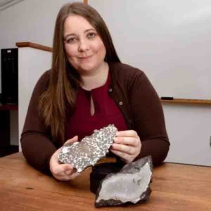 Jessica Irving sits with two meteorites Princeton seismologist Jessica Irving