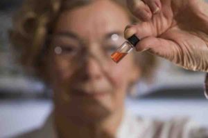 Vial of pink colored porphyrins representing the oldest intact pigments in the world.