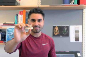 This is PhD student Mohamad Bazzi with a fossil lamniform shark tooth