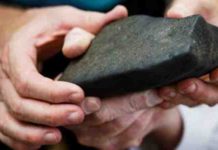 Detective mission to characterise and trace the history of a new African meteorite Close-up of the meteorite fragment showing the fusion crust.