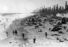 Oil extraction likely triggered mid-century earthquakes in L.A. Angelenos play below derricks at Huntington Beach pier, c. 1930-40. In the early decades of the twentieth century, LA residents accepted ground subsidence and small earthquakes as the cost of producing oil. But discontent began to rumble in the late 1930s. Rapid exploitation of Wilmington, one of the largest oil fields in California, and the Huntington Beach field caused Long Beach harbor to sink, buckling railway lines and forcing the city to build higher piers. Credit: Orange County Archives