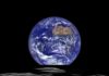 The rising Earth from the perspective of the moon.