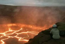 Volcanologist jams to the beat of the Earth’s drummer Brittany Erickson, an assistant professor in the Department of Computer and Information Science who studies geophysics and is a colleague of UO’s Leif Karlstrom, peers into the Halema'uma'u lava lake on Hawai’i’s Kiīlauea volcano. Credit: University of Oregon