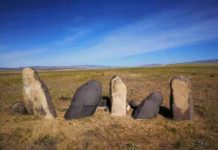 5,200-year-old grains in the eastern Altai Mountains redate trans-Eurasian crop exchange A photo of the stone men (Chimulchek Culture) in the steppe area of Altai Mountains. These figures are characteristic of the peoples who lived in the area around the time of occupation at Tongtian. These specific examples are located at the Chimulchek site (ca. 4000 years old) and not far from Tongtian Cave. Ceramic sherds from the cave suggest that the occupants in the cave shared similar cultural traits to other people in the region. Credit: Jianjun Yu