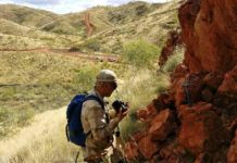 Geologists determine early Earth was a ‘water world’ by studying exposed ocean crust Benjamin Johnson of Iowa State University woks at an outcrop in remote Western Australia where geologists are studying 3.2-billion-year-old ocean crust. Photo by Jana Meixnerova. Photos provided by Benjamin Johnson.