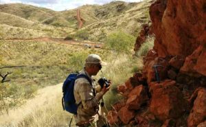 Benjamin Johnson of Iowa State University woks at an outcrop in remote Western Australia where geologists are studying 3.2-billion-year-old ocean crust. Photo by Jana Meixnerova. Photos provided by Benjamin Johnson.