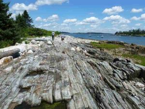 Research suggest that rocks colliding inside fault zones, like this one in Maine, may contribute to damaging high-frequency earthquake vibrations. Credit: Julia Carr