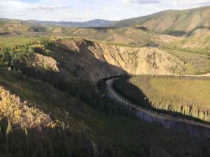 Broad surfaces called terraces preserve ancient river floodplains and landscape history up to hundreds of meters above the Fortymile River, a tributary of the Yukon River, in eastern Alaska. Researchers from the USGS, the University of Vermont, Purdue University and Utah State University publish definitive support that increases in sediment deposited to oceans from river erosion coincide with dramatic changes in glacial cycles. Credit: USGS