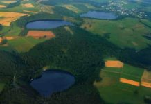 New evidence of long-term volcanic, seismic risks in northern Europe Three water-filled maars, created by volcanic eruptions, in Germany’s Eifel region. Credit: Martin Schildgen/Wikimedia Commons