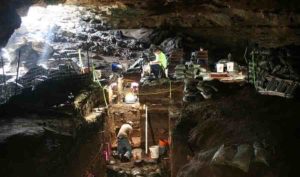 Workers excavating Hall’s Cave in Central Texas. Image Courtesy of Michael Waters