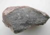 Meteorite study suggests Earth may have been wet since it formed Piece of the meteorite Sahara 97096 (about 10 cm long), an enstatite chondrite that contains about 0.5 weight % of water. If Earth formed entirely of this material, it would have received 23 times the total mass of water present in the Earth's oceans. Credit: L. Piani, Museum of Natural History in Paris