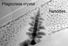 Scientists shine light on tiny crystals behind unexpected violent eruptions Nanolite 'snow' surrounding an iron oxide microlite 'Christmas tree'. Even these small 50 nm spheres are actually made up of even smaller nanolites aggregated into clumps. Christmas has come early this year for these researchers. Credit: Brooker/Griffiths/Heard/Cherns