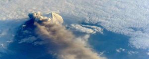 A plume of ash and dust rises from Pavlof Volcano on the Alaskan Peninsula in 2013. Credit: NASA