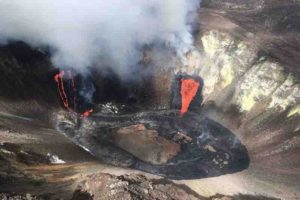 A plume rises near active fissures in the crater of Hawaii's Kilauea volcano on Monday, Dec. 21, 2020. People are lining up to try to get a look at the volcano on the Big Island, which erupted last night and spewed ash and steam into the atmosphere. A spokeswoman for Hawaii Volcanoes National Park says the volcanic activity is a risk to people in the park Monday and that caution is needed. (M. Patrick/U.S. Geological Survey via AP)