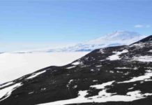 Antarctic Lava Yields Clues to Earth’s Past Magnetic Field Rock samples collected near the Antarctic volcano Mount Erebus, seen here in the distance, harbor fingerprints of Earth’s ancient magnetic field. A new analysis delves into discrepancies between these fingerprints and predictions from a long-standing approximation of the field. Credit: Hanna Asefaw