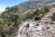 Scientists probe mysterious melting of Earth’s crust in western North America From left, University of Wyoming students Shane Scoggin, Adam Trzinski and Jessie Shields are part of new research investigating crustal melting in western North America. Here, they examine igneous rocks in the Snake Range of Nevada. Credit: Jay Chapman