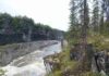 Longest known continuous record of the Paleozoic discovered in Yukon wilderness Ordovician black shales of the Mount Hare Formation, Road River Group (approximately 465 million years old) rise above conglomerates of the Aberdeen Member. The dangerous rapids of Aberdeen Canyon (Nan Zhak Nadhàdlaii), created by the Peel River cutting through the resistant conglomerates, appear at bottom left. (Image credit: Erik Sperling)