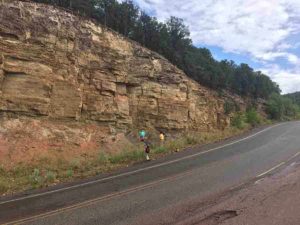 Photo courtesy Gunther Kletetschka Geologists inspect an outcrop near the sample collection site in New Mexico. 