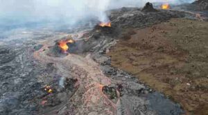 he Fagradalsfjall eruption site viewed from above. The photo shows lava emanating from multiple vents. Tourists for scale.  Photograph: Alina V. Shevchenko and Edgar U. Zorn, GFZ Germany 