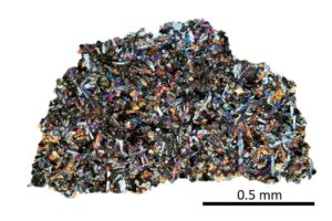 Thin section of NASA sample, LAP 02436, Lunar Mare Basalt containing indigenous noble gases. Image type: optical microscopy, cross-​polarized light. (Image: ETH Zurich / Patrizia Will)