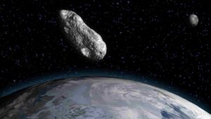  A depiction of an asteroid heading toward Earth, with the moon in the background. (Image credit: Juan Gartner via Getty Images) 